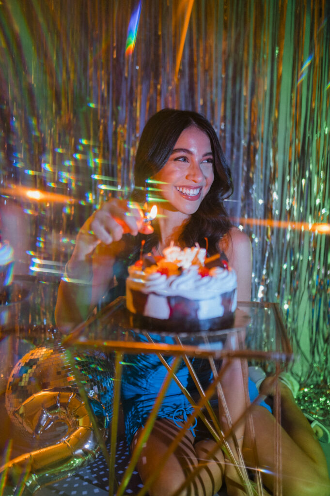 lighting candles on a birthday cake